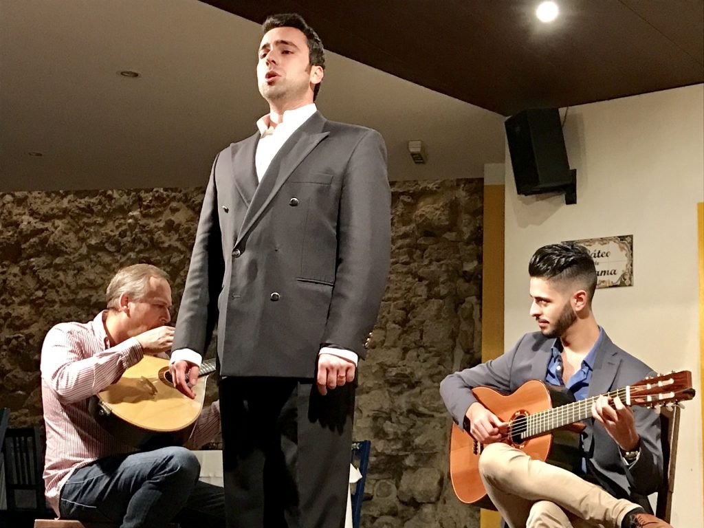 Fado, the traditional songs of longing accompanied by guitar.