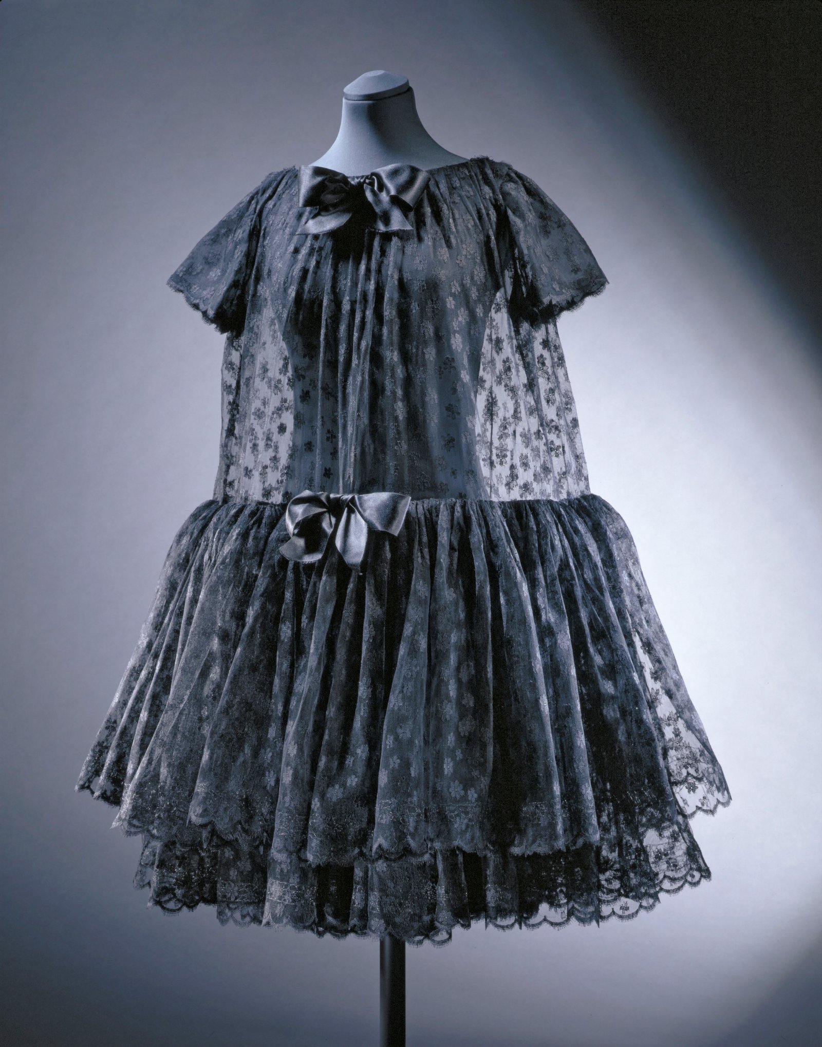 Evening dress, tiered machine made lace layered over silk with satin bows;  Possibly by Balenciaga;  French (Paris);  1950`s.