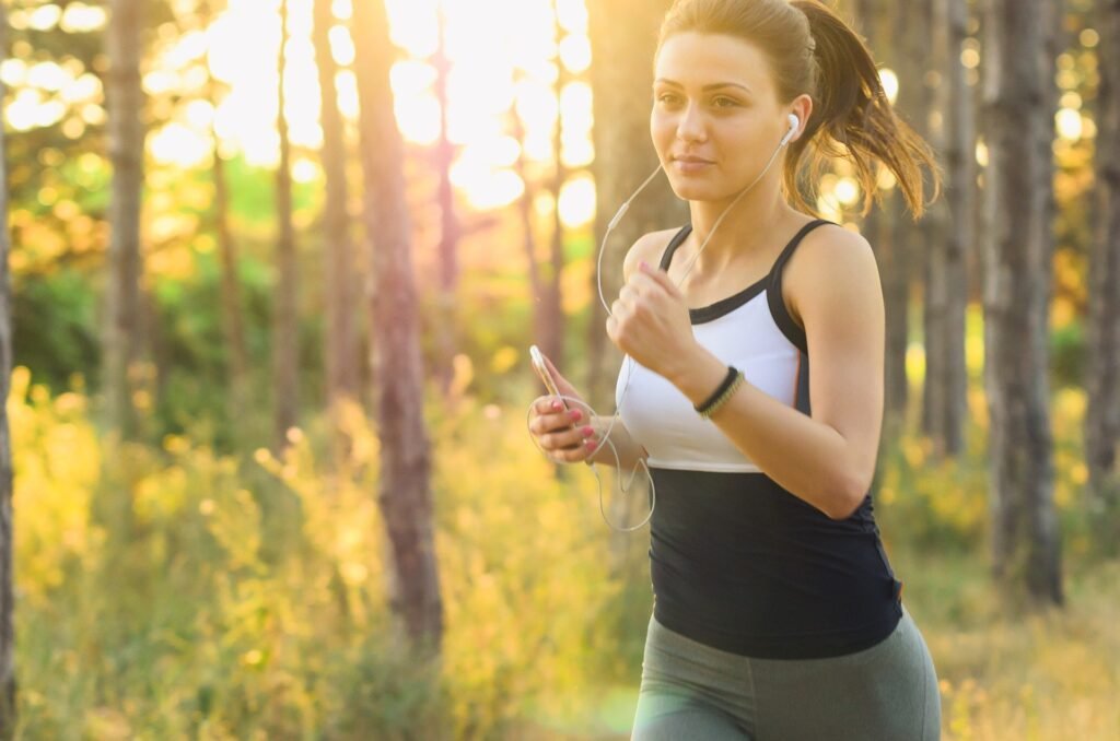 girl running in the woods