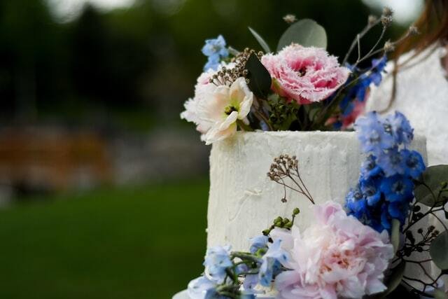 wedding cake with blue flowers