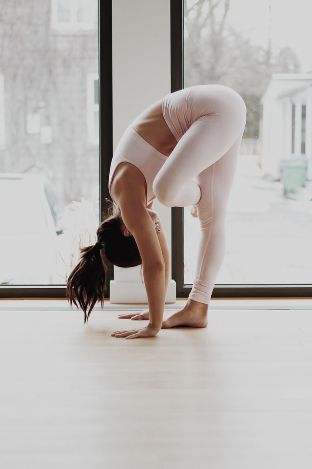 woman doing yoga at home