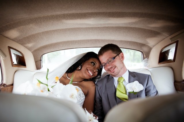 bride and groom in the limo