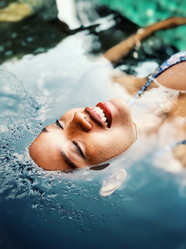 woman floating at spa wellness retreat