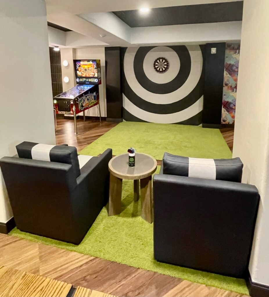 The Adult Dive Lounge is a fun spot for a drink, to watch a game or play darts.