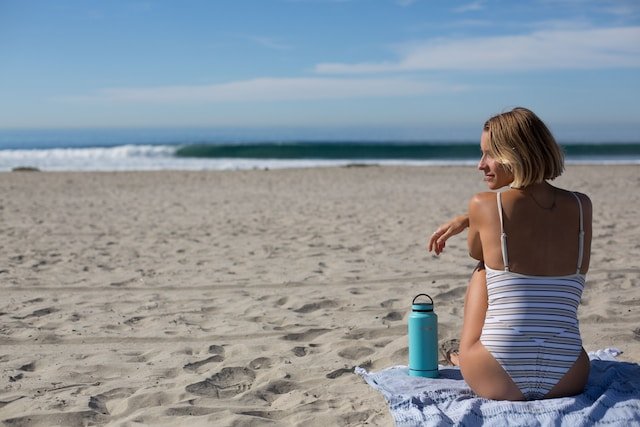 woman sitting on the beach