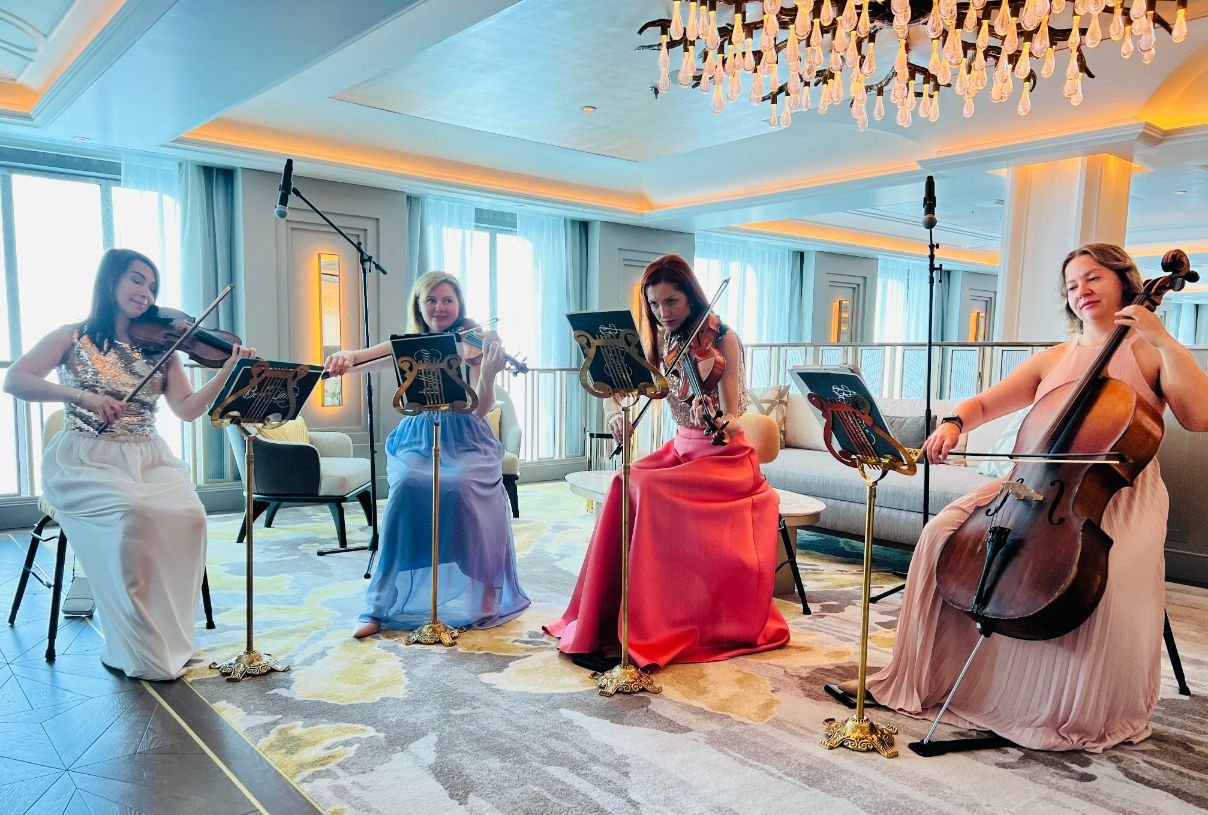 A quartet of talented musicians provide a lovely backdrop to happy hours.