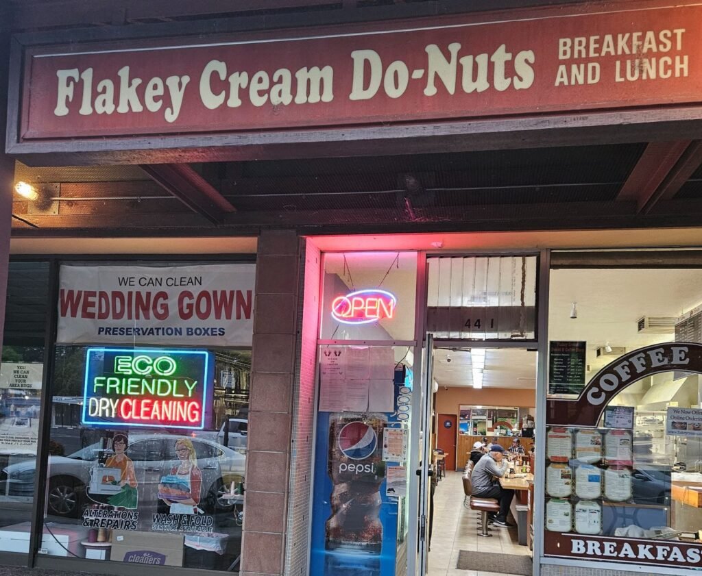 Appreciating the open sign at 530am at Flakey Cream Do-Nuts, Photo by Darla Hoffmann