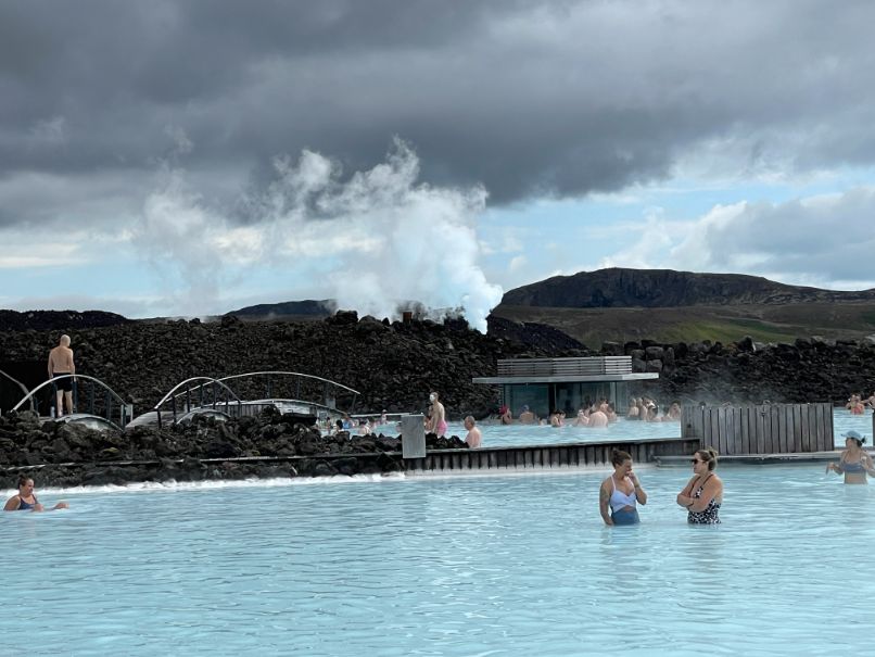 The lagoon is surrounded by black lava rocks