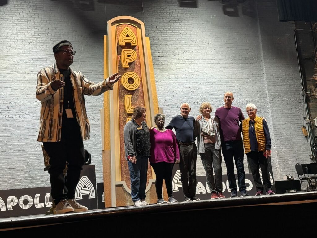 Volunteers take the stage to perform during an Apollo Theater tour