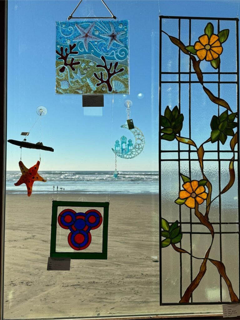 Window art frames the ocean