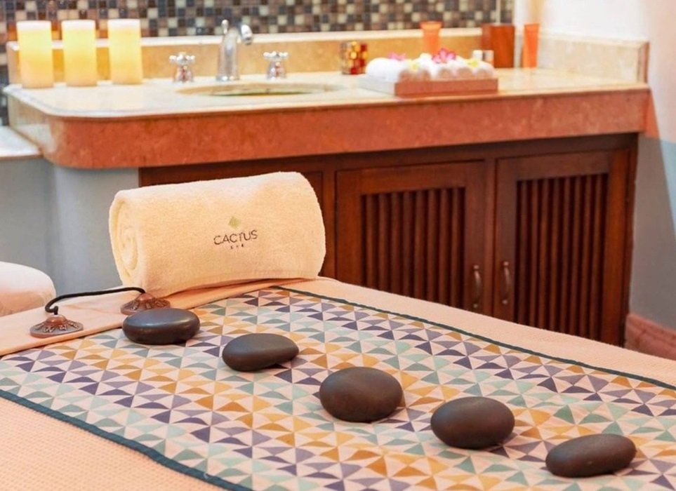 Massage table with hot stones