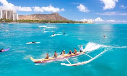 Catch some waves on an outrigger surfing canoe ride at Waikiki Beach