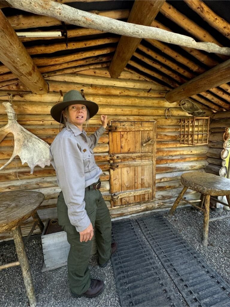 Park ranger in front of Proenneke's cabin. Photo by Debbie Stone