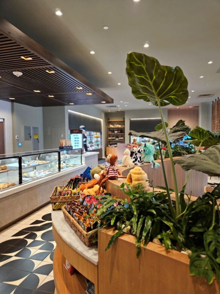 Counter to left full of pastries and sandwiches, on the right counter of pants and gifts at the Camino Market at the Grand Hyatt in Indian Wells