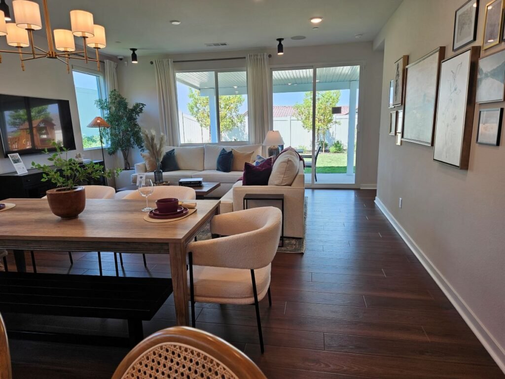 A view from the kitchen of dining room and living room