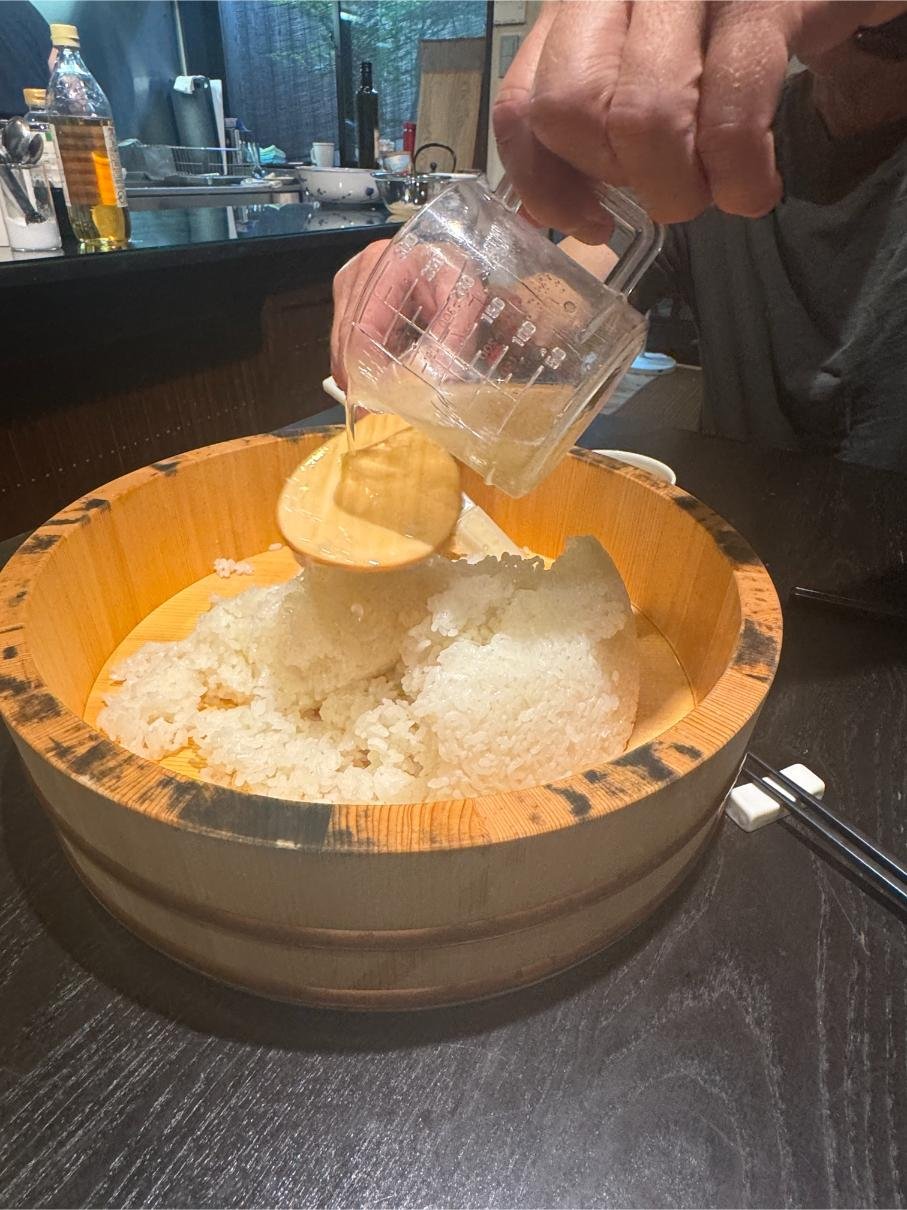 Making vinegar rice for sushi. Photo by Debbie Stone