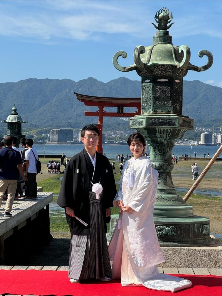 Wedding couple poses on Miyajima. Photo by Debbie Stone