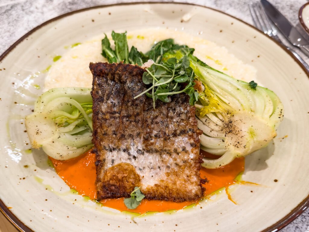 Pan-Seared Pacific Sea Bass at Haven Point Provisions & Spirits Restaurant at Sonesta Irvine