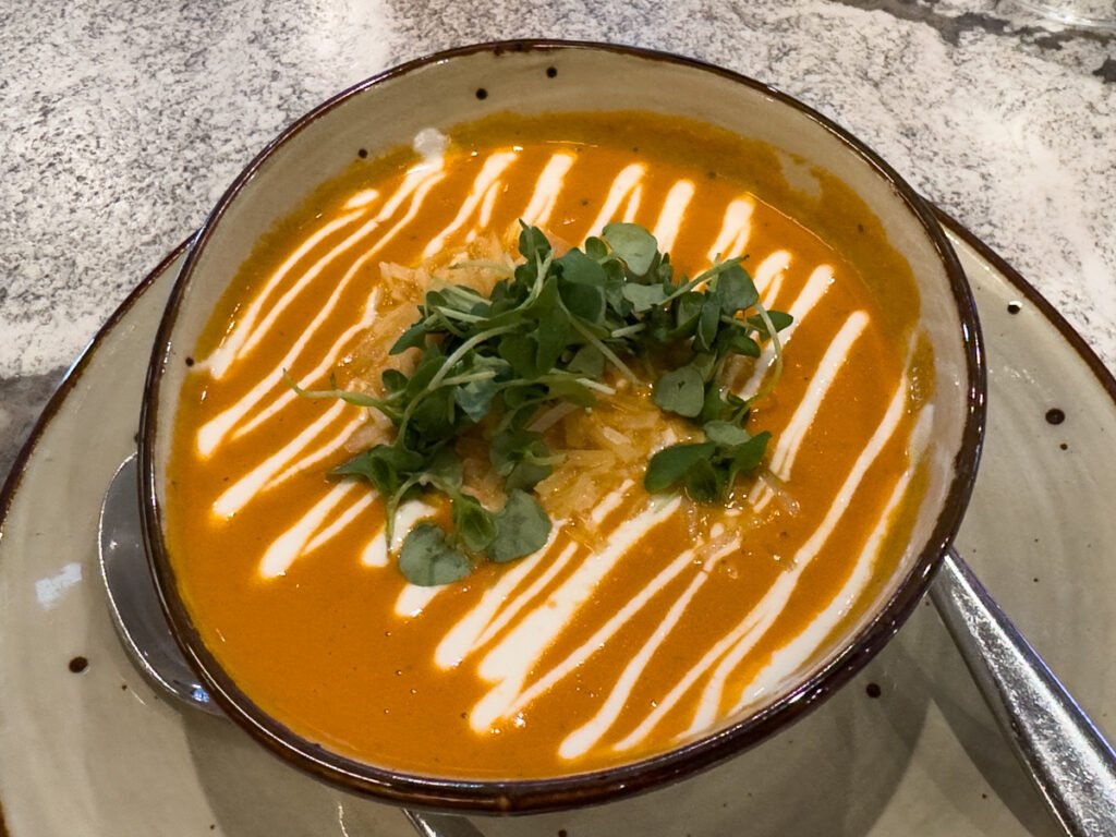 Savory Tomato Bisque Soup at Haven Point Provisiona & Spirits Restaurant Sonesta Irvine