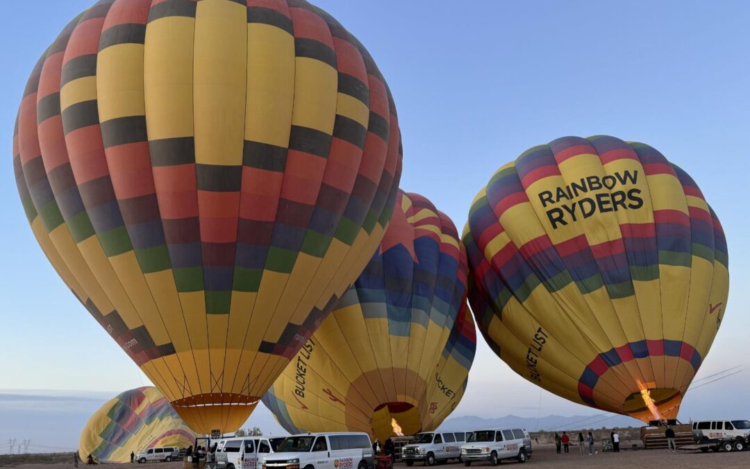 Soar above the serene Sonoran Desert in a hot air balloon with Rainbow Ryders